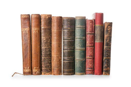 Old books row isolated on white, clipping path included