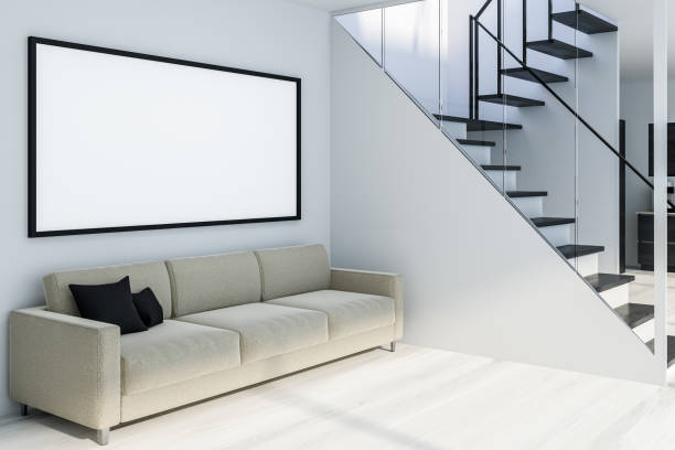 istock White living room corner with stairs and poster 1135599086