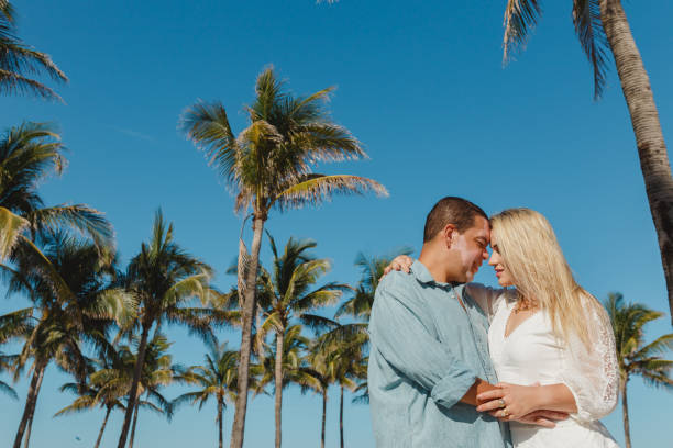 istock Couple in honeymoon walking on the beach 1135600273