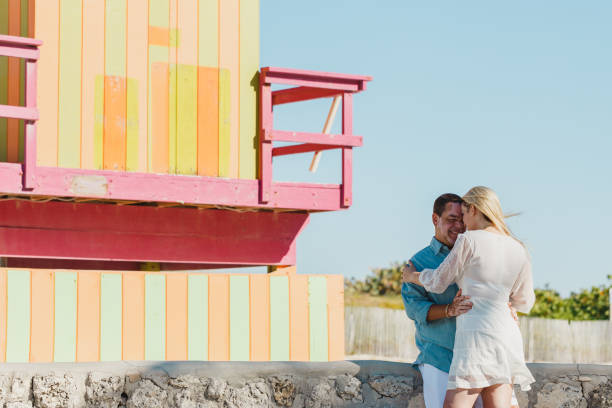 istock Couple in honeymoon walking on the beach 1135600292