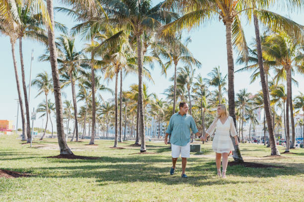 istock Couple in honeymoon walking on the beach 1135600309