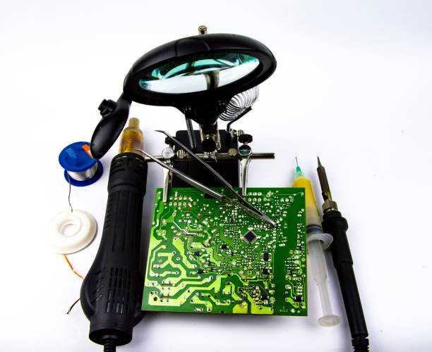 istock electronics repair - soldering iron, soldering station, magnifier 1135603207
