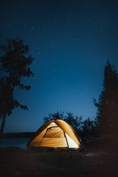 Camping under the stars Camping near the lake in the Boundary Waters Canoe Area in Minnesota. boundary waters canoe area stock pictures, royalty-free photos & images