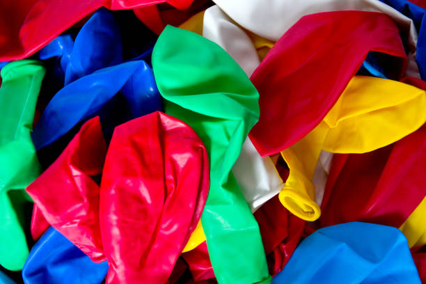 istock colorful flat balloons isolated on black wooden surface 1135605823