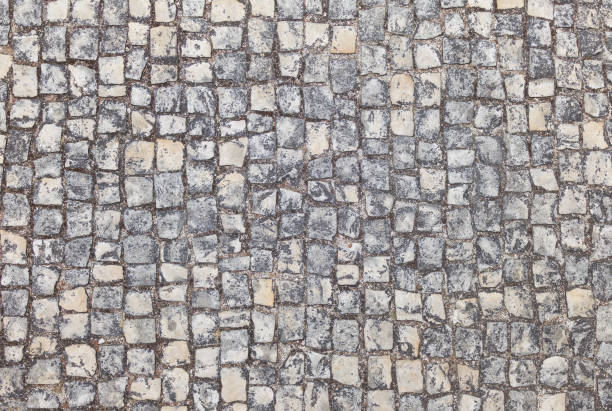 istock Abstract background of old cobblestone pavement close-up. 1135607298