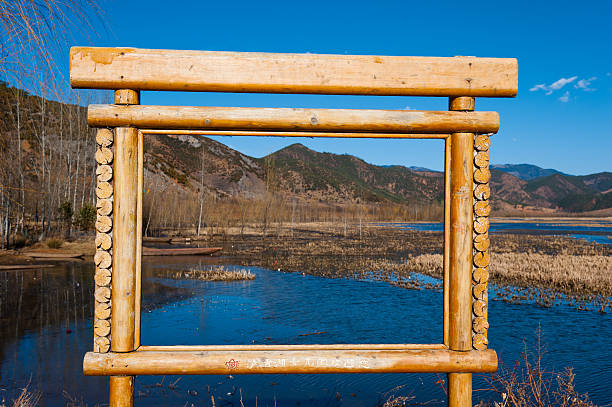Traditional wooden boats floating in the Lugu Lake, Yunnan, China