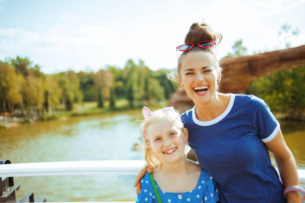 istock smiling mother and daughter travellers having river voyage 1135610161