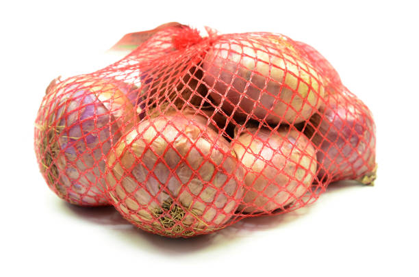 istock Pack of red onions isolated 1135612981