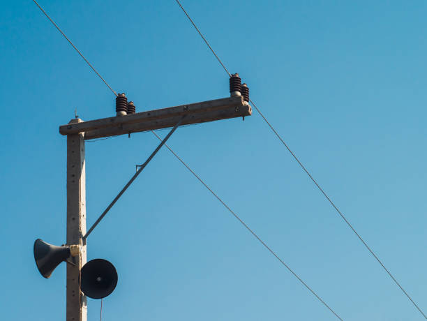istock Electric post pole and blue sky background 1135613001