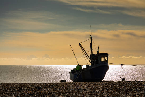 Inshore fishing boat moored at a stone pier at Kircubbin, County Down (Northern Ireland).