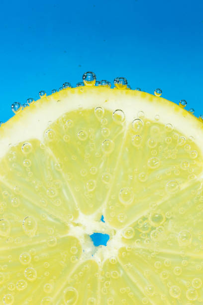 istock Nice fresh lemon covered with bubbles in soda. 1135613400