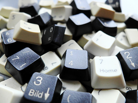 Black and white computer keyboard keys. Concept of unstructured big data that need to be sorted ready to be consumed by machine learning model for deep learning.