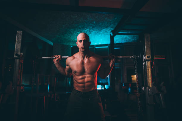 istock Man weightlifting in alone gym 1135616568