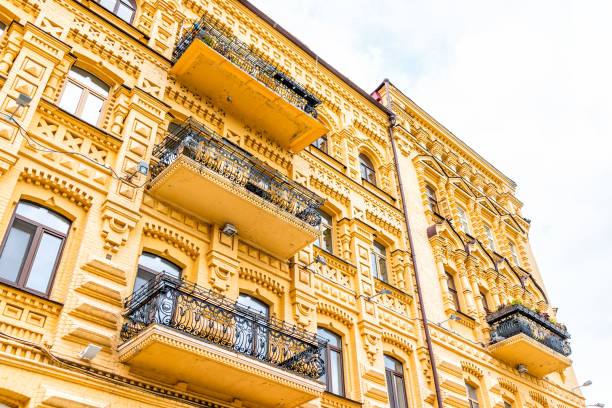 kyiv, ukraine view of old modern historic town colorful vibrant golden gold orange yellow building apartment flats of kiev city in podil andriyivskyi uzviz descent - 12042 imagens e fotografias de stock