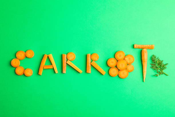 istock Inscription carrot on green background, space for text 1135617808