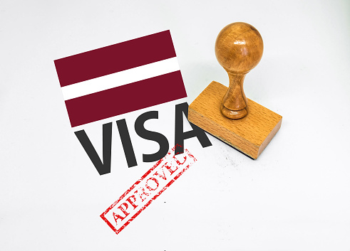 Latvia Visa Approved with Rubber Stamp and flag