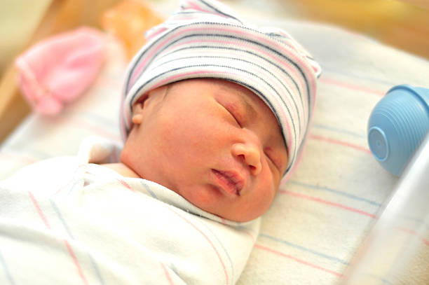 istock newborn girl sleeping 113562155