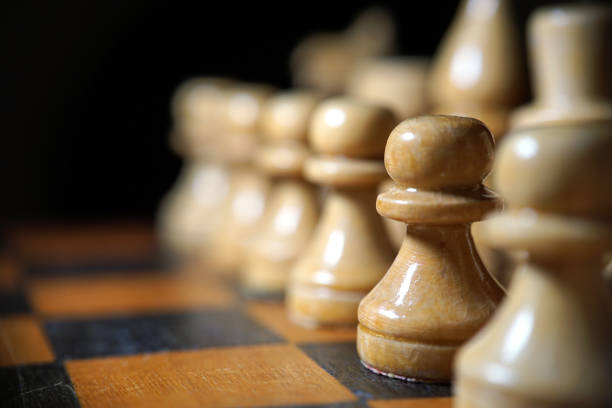 istock Chess figures macro photo in the dark 1135622598