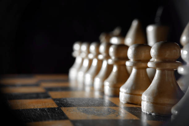 istock Chess figures macro photo in the dark 1135623136