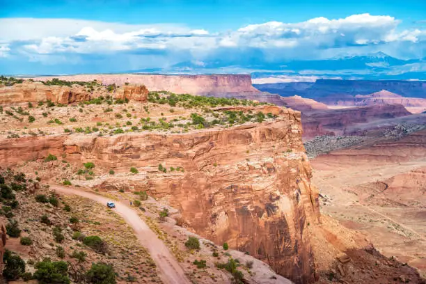 Stock photograph of Shafer Trail Road in Canyonlands National Park and the La Sal Mountains in the distance, Utah, USA.