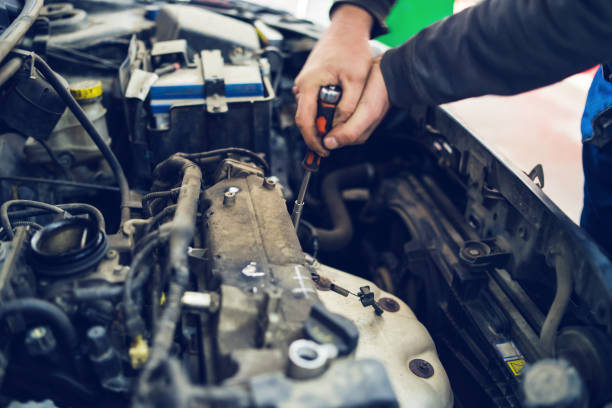 istock Close Up on Mechanics hands repairing opening car engine 1135624756