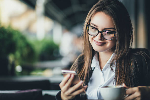 istock Young woman drinking coffee in a cafe,enjoying coffee break 1135625683