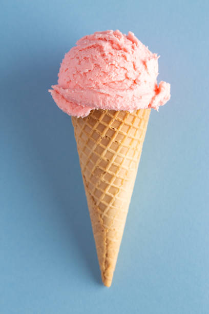 istock A Scoop of Strawberry Ice Cream in a Waffle Cone 1135628450