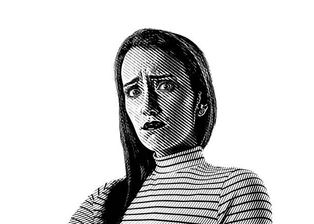 istock Close up of a young woman with stressed out facial expression 1135629411