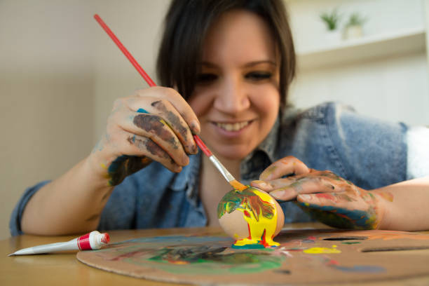 istock Close up of woman painting Easter egg , Easter collection 1135631597