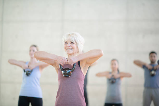 istock Senior woman with kettle bell 1135632652