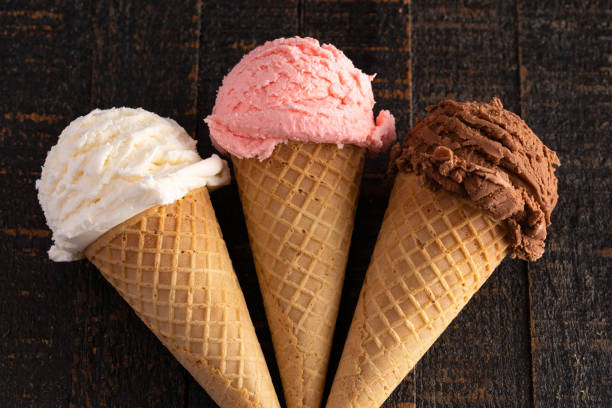 istock Three Classic Flavors of Ice Cream on a Wooden Table 1135634740