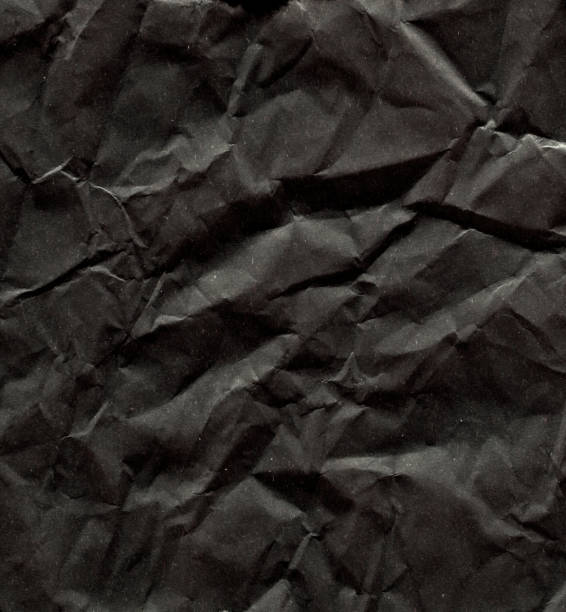 istock Front View of Crumpled Black Paper Background 1135638344