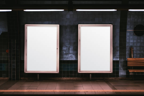 Two vertical posters mockup in metro Two empty ad vertical posters templates on a metro platform; blank information banners placeholders indoors; a subway or a train station with two white billboards in front of a blue tile wall underground photos stock pictures, royalty-free photos & images