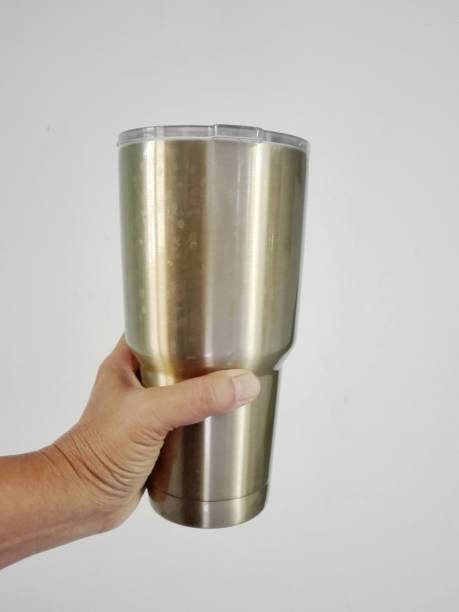 istock Hand holding stainless steel mug 1135639852