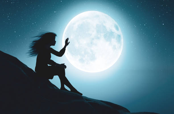 istock Alone girl touching the moon 1135652508