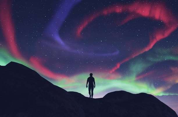 istock Man walking to the southern lights 1135652510