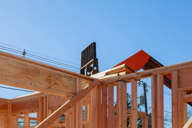 istock Residential construction home, wood beams with blue sky at construction 1135653557