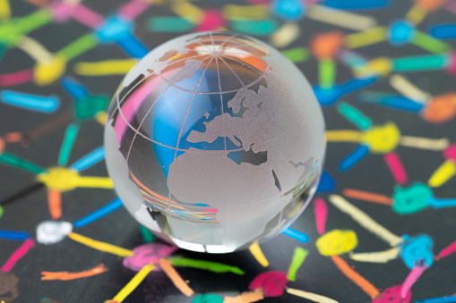 Decoration glass globe with Europe map on blackboard of colorful connecting dot as financial and economics network using as Euro and brexit impact concept.