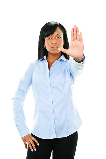 istock Serious young woman giving stop gesture 113565958
