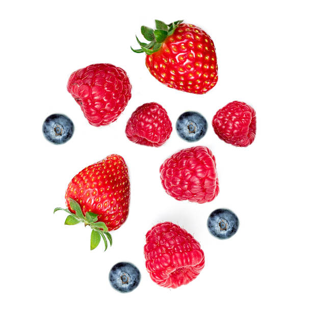 istock Mixed  flying berries. Strawberry, Raspberry, Blueberries  and Mint leaf  isolated on white background, top view, flat lay