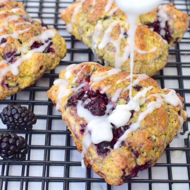 istock Blackberry lime scones pouring with glaze sugar 1135669724