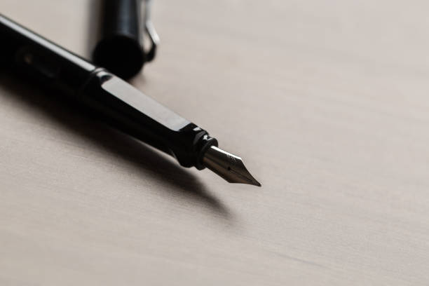 istock Black fountain pen on table 1135674729