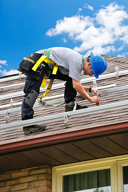 istock Man working on roof installing rails for solar panels 113567631