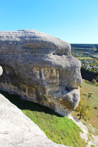 istock natural rock looks like human face 1135678551