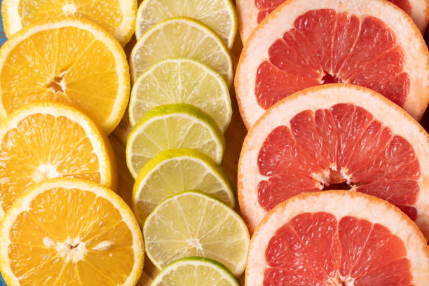 istock Flat lay view slices of different raw fresh citrus fruit. 1135682755