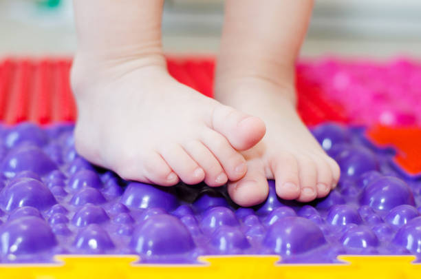 istock children's feet on an orthopedic mat 1135683587
