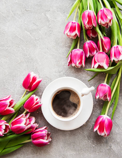 istock Cup of coffee and tulips 1135683634