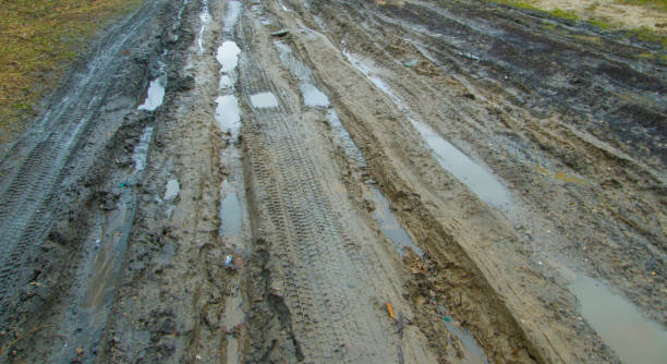 istock Worn dirty country road. 1135685026