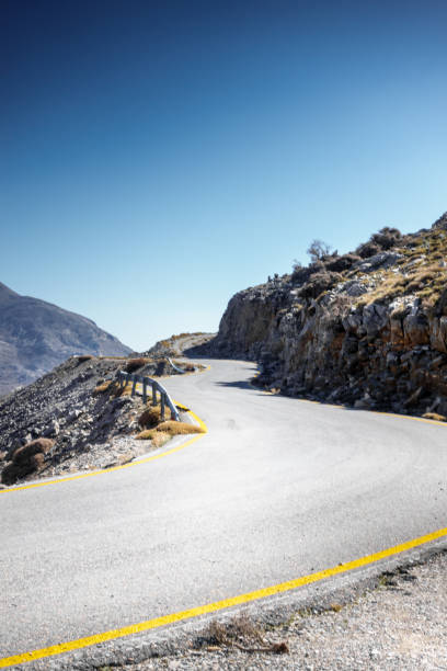 istock Curvy single lane road Crete Greece Europe 1135687504