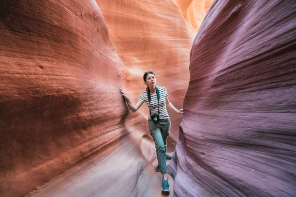 istock photographer walking upper antelope canyon 1135691374